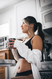 Woman in kitchen making healthy food choices during no sugar diary